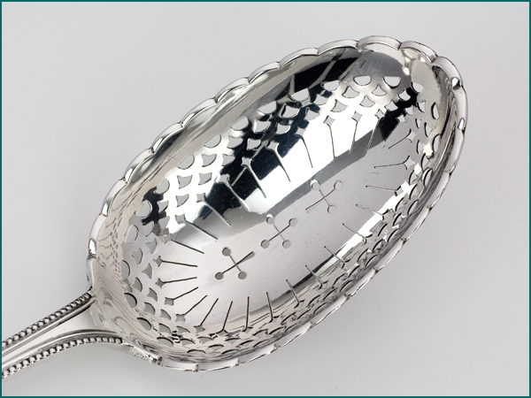 Zilveren natfruitlepel met parelrand uit 1899-7187