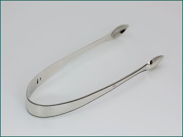 Zilveren kandijtang met parelrand uit 1801-0