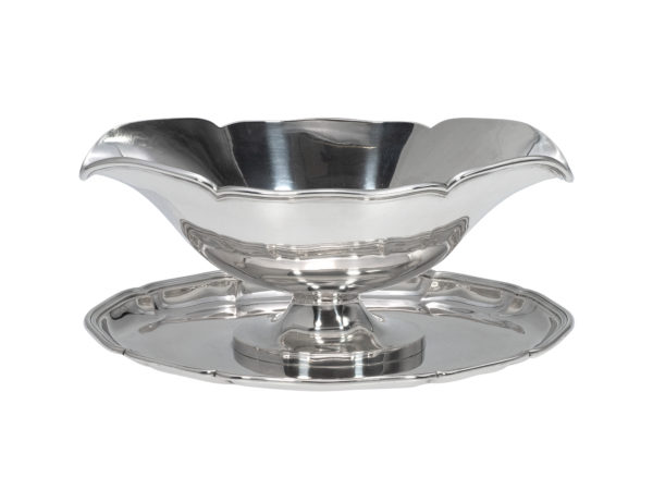 Zilveren sauskom op onderblad uit 1925